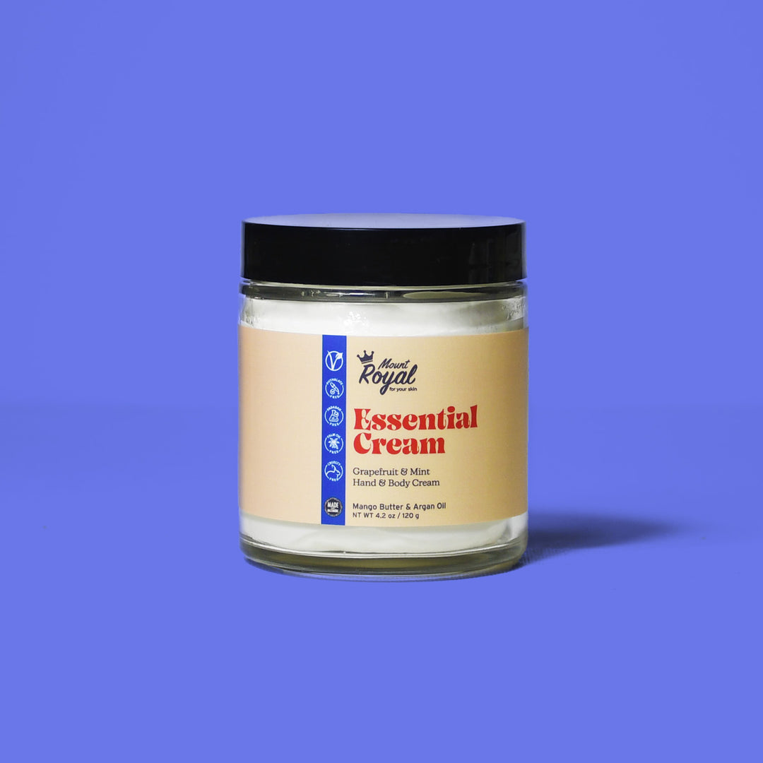 Essential Cream jar on a blue background