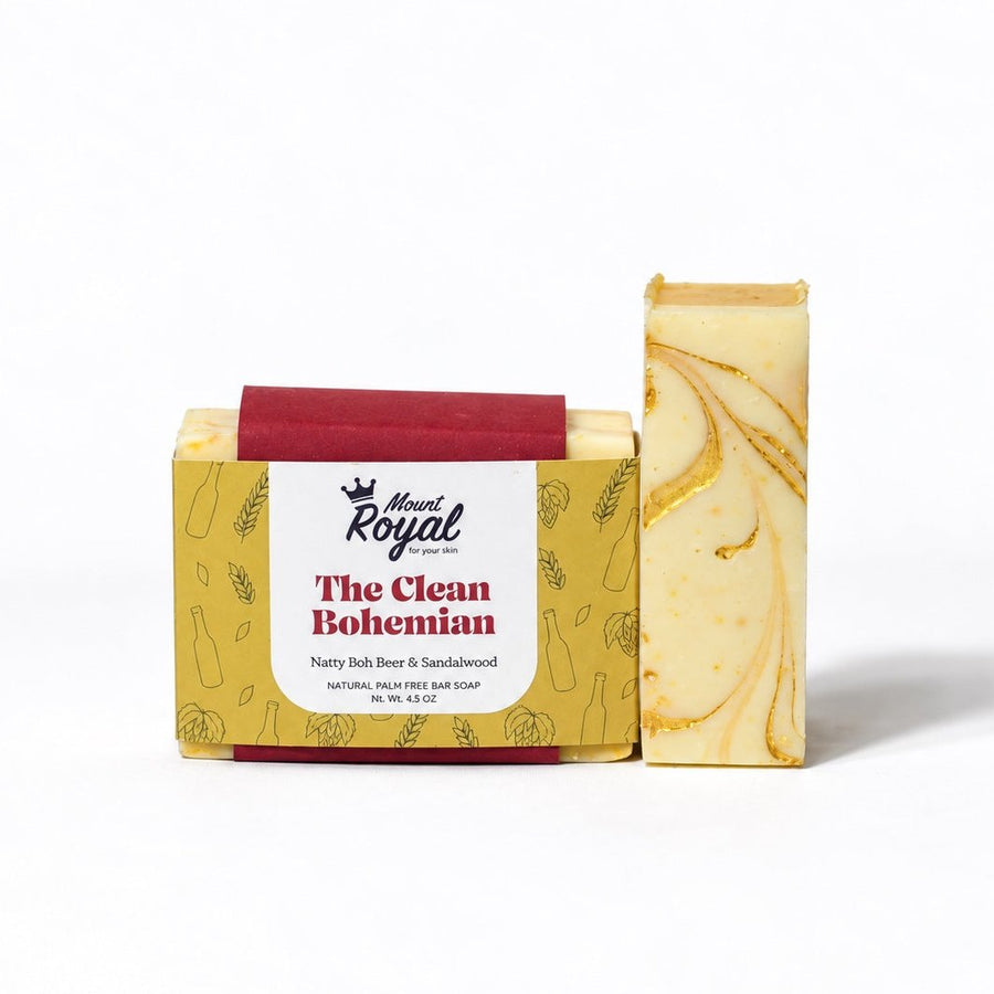 Mount Royal The Clean Bohemian Natty Boh beer and sandalwood bar soap with gold botanical packaging on a white background