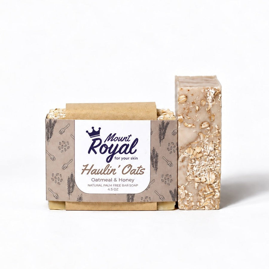 Haulin’ Oats oatmeal and honey bar soap, packaged and unwrapped bars on a white background.