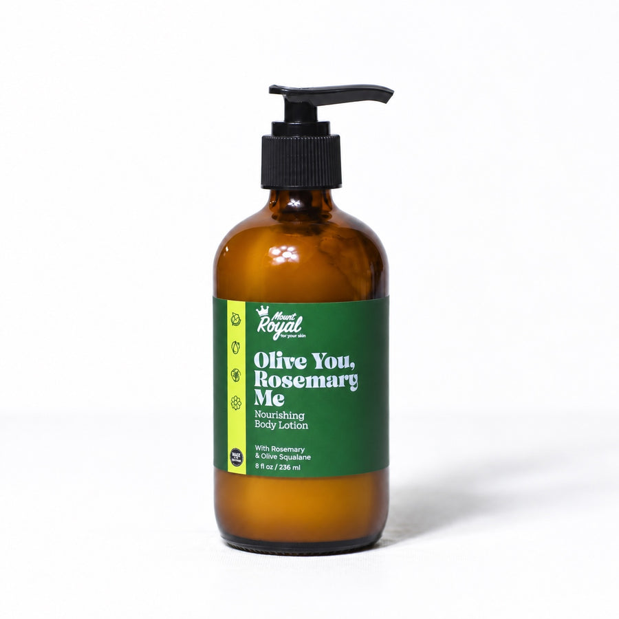 Mount Royal Olive You, Rosemary Me body lotion in an amber glass pump bottle on a white background