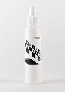 Checker patterned 4 ounce hand sanitizer spray bottle.